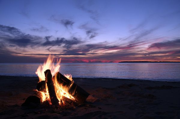 Campfire on the beach at sunset